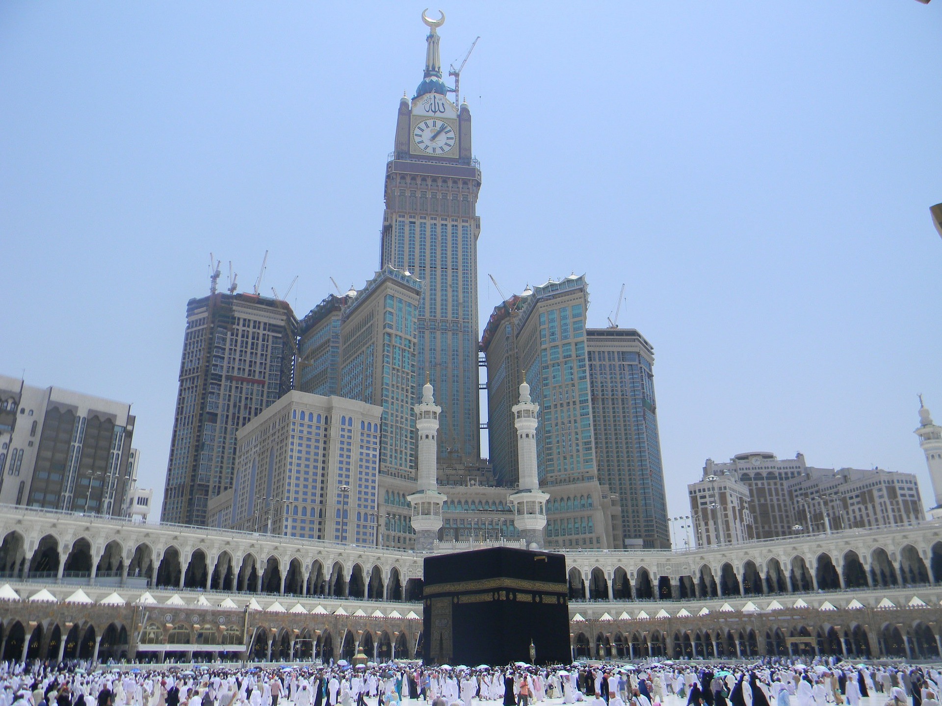 The Kaaba in Mecca with the Makkah Royal Clock Tower Hotel